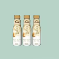 Bottled Plant Milk Drink with Oat Flavor Displayed on Light Green Background