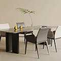 Modern Dining Table Set With Marble Top White Grey Chairs Green Plant And Yellow Fruits