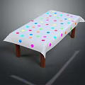 Table Covered With Colorful Polka Dot Tablecloth And Wooden Legs Design