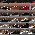 Various Styles Of Shoes In Multiple Colors Displayed On Shelves For Casual Wear