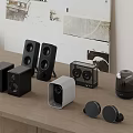 Various Audio Devices With Different Designs Arranged On Wooden Table And Decorative Wall Art Background