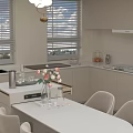 Modern Kitchen Interior With Round White Dining Table Set And Chairs And Chandelier