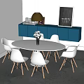 Modern White Round Dining Table With White Chairs Wooden Legs And Blue Cabinet Decorations