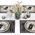 Elegant Dinnerware Set With Plates Cutlery Striped Placemats Decorative Bouquet And Glassware On Dining Table