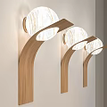 Modern Wall Lamps With Curved Wooden Brackets and Round Marble Shades Mounted on Wall
