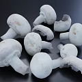 Fresh White Mushrooms with Whole and Sliced Pieces on Dark Surface
