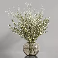 Delicate White Small Flowers with Green Branches in Transparent Glass Vase