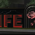 Decorative Building Exterior Wall With LIFE Lettering Golden Frame Rose Motifs And Arched Design