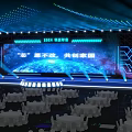 Contemporary Stage Setup With Blue Lighting Large Screen Display Text And Geometric Decor 3d model