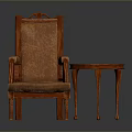 Brown Upholstered Armchair With Wooden Frame And Small Round Table