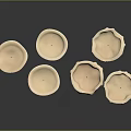 Beige Cylindrical Decorative Candles With Wax Drips On Dark Surface