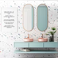 Modern Pink Washbasin on Light Blue Countertop with Brass Faucet Black Vase and Green Plant