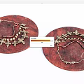 Gold Jewelry Pieces With Decorative Patterns And Beads On Round Wooden Trays