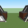 A frame Guesthouse Building With Black Roof Brown White Walls On Green Lawn