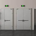 Gray Emergency Exit Doors With Fire Safety Equipment And Green Signs