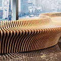 Artistic Sculpture in Modern Interior With Curved Wooden Bench Large Windows And City View