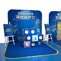 Blue Exhibition Booth Design With Multiple Display Screens And Seating Areas 3d model