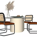 Modern Dining Table Set With Wooden Top Metal Legs Woven Chairs And Pampas Grass Vase