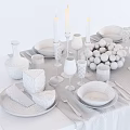 Elegant White Dinnerware Set with Plates Bowls Glasses Candle Holders Decorative Balls on Dining Table