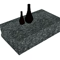 Modern Gray Marble Textured Coffee Table With Two Black Vases On Top