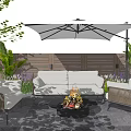 Comfortable Outdoor Sofa With Wicker Chairs Fire Pit And Umbrella For Cozy Patio Garden Setting