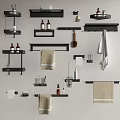 Black Bathroom Accessories With Shelves Towels Bottles Hooks And Toilet Paper Holder On Light Wall