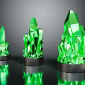 Three Green Crystal Like Decorative Pieces On Black Reflective Bases