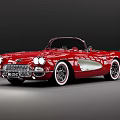 Red Classic Convertible Sports Car With Chrome Accents White Wall Tires And Retro Design