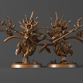 Two Bronze Mythical Creature Sculptures With Intricate Horns Wings And Circular Bases