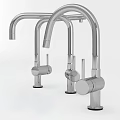 Three Modern Stainless Steel Faucets With Curved Spout And Sleek Design
