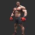 Muscular Man With Red Boxing Gloves Black Shorts And Sports Shoes Standing Against Gray Background