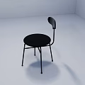Modern Black Leisure Chair With Round Seat Curved Backrest And Metal Legs In White Room