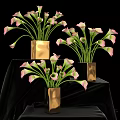 Pink Calla Lilies in Gold Square Vases on Black Cloth Background