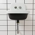 Modern Wall Mounted Washbasin On Black And White Grid Tiled Wall With Silver Drain Pipe