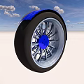 Silver Rimmed Tire with Black Outer Ring and Blue Center Cap Against Blue Sky White Ground