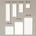 White Picture Frames in Various Sizes Displayed on Wall Surface