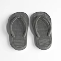 A Pair of Gray Flip Flops Isolated on White Background with Textured Soles