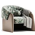 Elegant Green Floral Armchair With Round Cushion And Gray Throw Blanket