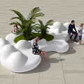 Cloud Shaped Public Seating With Green Plants And People Relaxing On Tile Floor