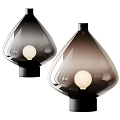 Modern Teardrop Shaped Table Lamp With Transparent Glass Shade And Black Base