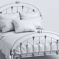Black Metal Single Bed with Curved Frame White Patterned Linens and Navy Pillows