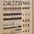 Various Wall Mounted Hooks With Different Designs On Wooden Display Board 3d model