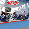 Yamaha Exhibition Booth Featuring Curved Canopy Displaying Motorcycles And Brand Logos