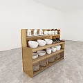 Black Kitchen Storage Shelf With White Bowls Mugs Brown Containers And Metal Mesh Baskets