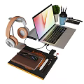 Sleek Modern Laptop Desk Setup With Wireless Headphones Books Stationery And Green Potted Plant
