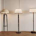Modern Elegant Floor Lamps With Tripod Column Bases White Shades And Gold Accents