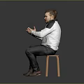 Man Sitting On Chair Clasping Hands In White Jacket Dark Pants And Brown Shoes Against Gray Background