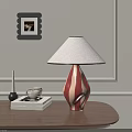 Red White Striped Table Lamp With Beige Lampshade On Wooden Table With Books And Cup