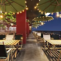 Modern Restaurant Interior With Wooden Ceiling Red Walls Pendant Lights And Dining Areas
