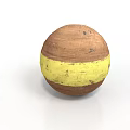 Round Brown Food Ball With Yellow Stripe And Spotted Surface Details